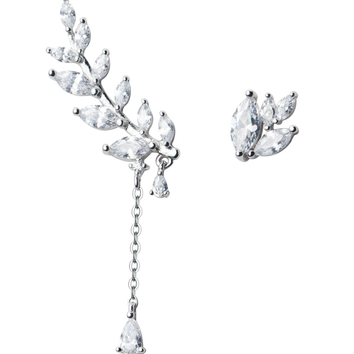 Leaf Climber Earrings: a sparkling leaf ear climber with a drop chain and a matching leaf stud, on a white background